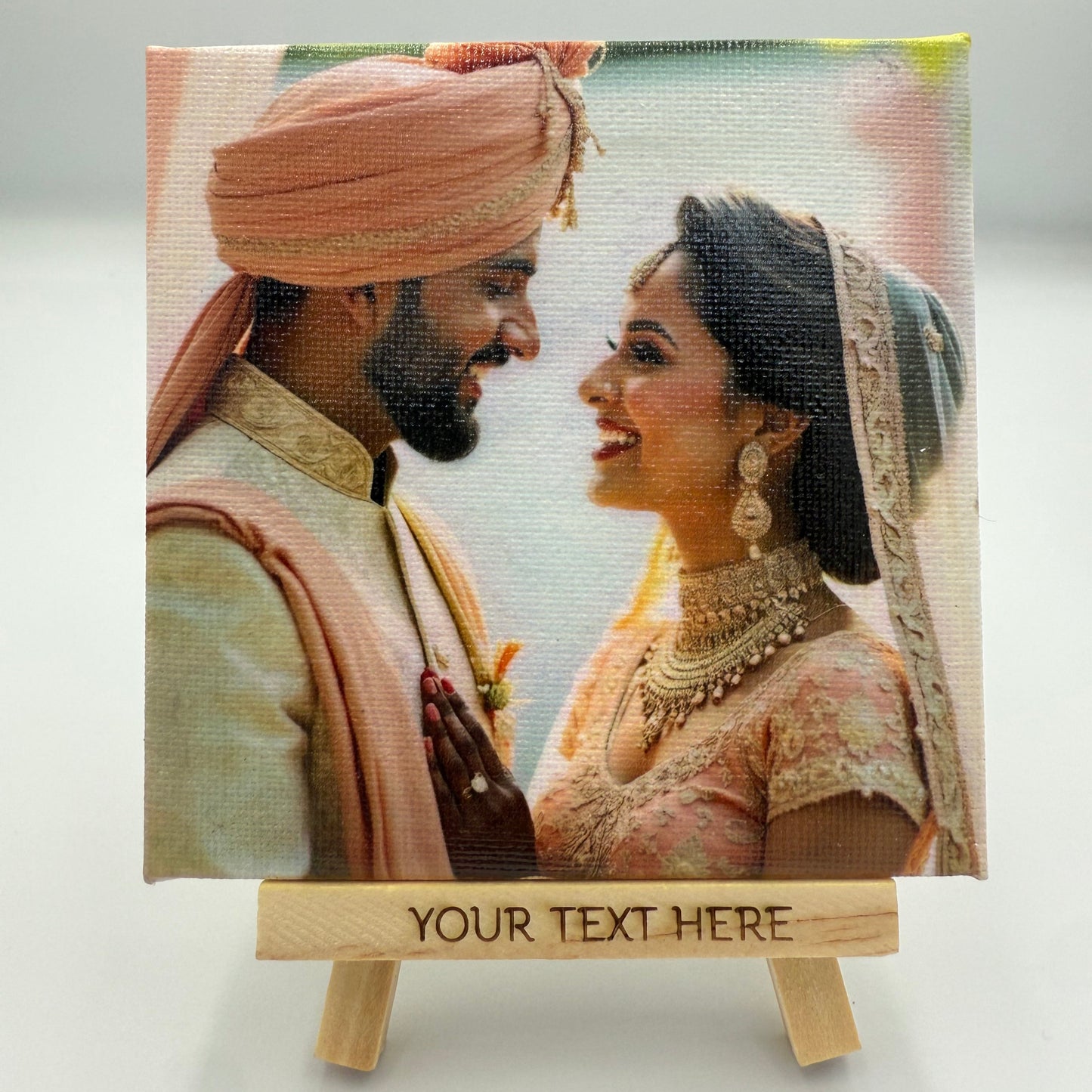 Personalized photo canvas with a couple and customizable text on a light gray background