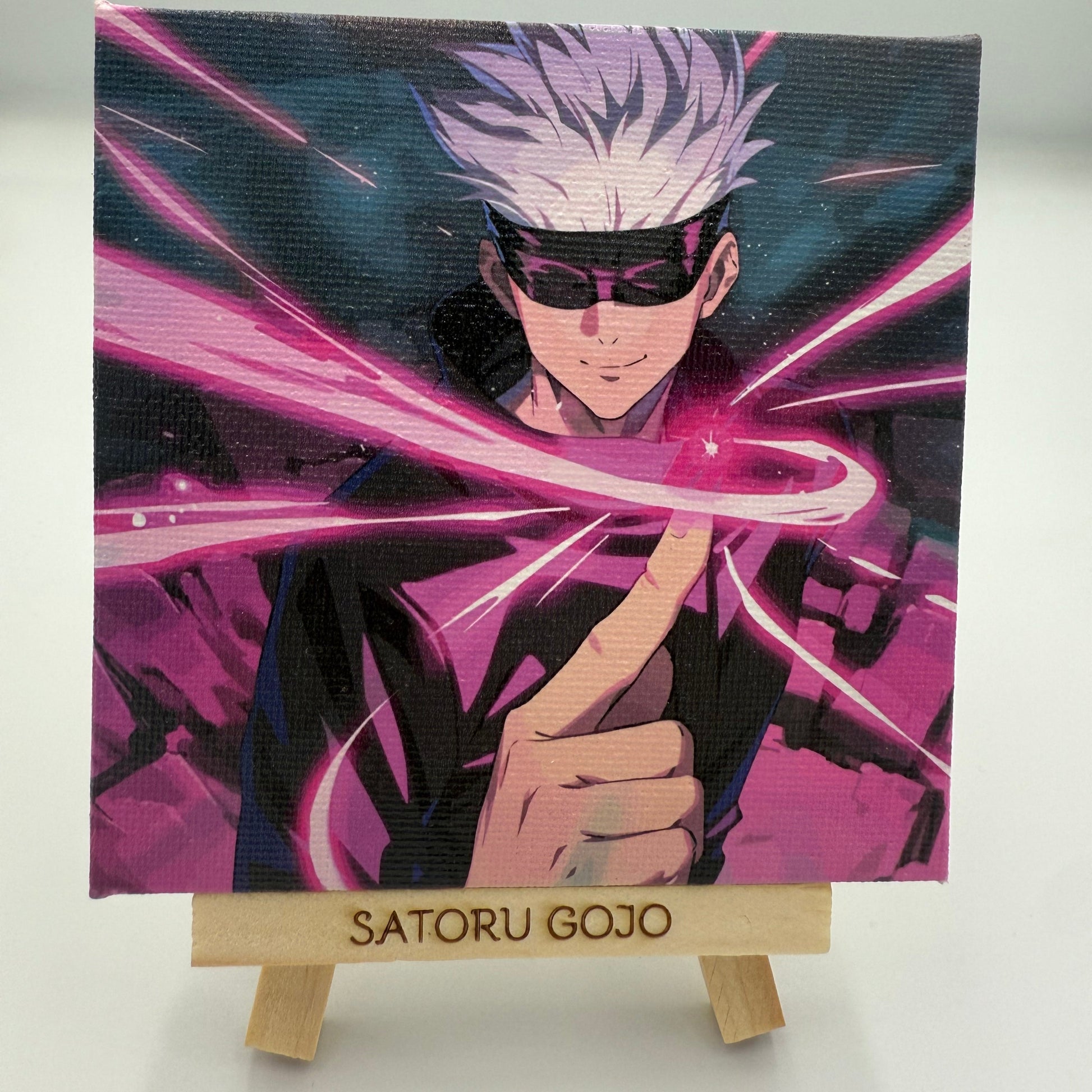 Anime character with white hair and pink energy on a book cover with 'Satoru Gojo' text